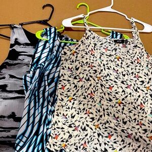 Three sleeveless dress tops .